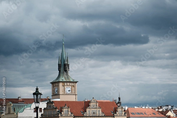 Fototapeta Buildings and streets in central Prague. Architecture of the Czech capital on a summer day.