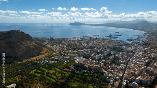 Fototapeta Panoramic aerial view of the Gulf of Palermo, Italy. The city, the capital of Sicily, overlooks the Mediterranean Sea with its houses and its important port.