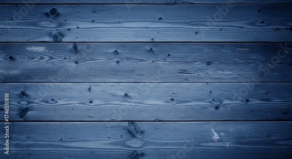 Fototapeta A deep blue textured background of weathered horizontal wooden planks. The rustic surface shows prominent wood grain and knots, creating an authentic, tactile feel. Ideal for design projects, product 
