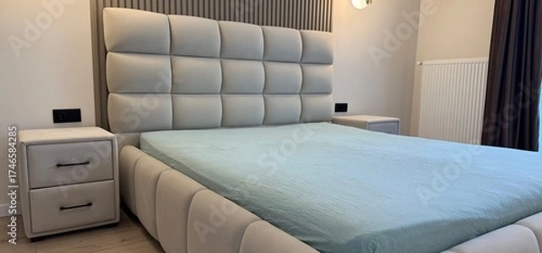 Fototapeta Stylish bedroom interior with comfortable large bed and nightstands