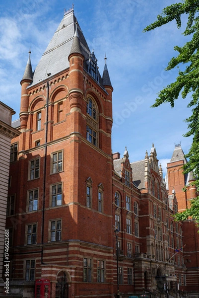 Obraz London - 06 25 2022: View of one of the towers and the entrance to the Royal College of Music Museum