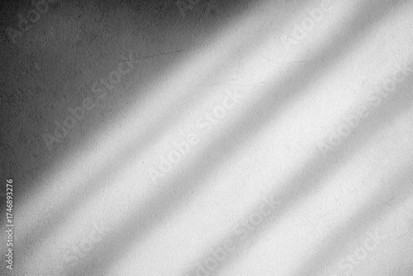 Fototapeta Soft, diagonal shadows cast across a plain white wall create a serene and minimalistic effect. The subtle texture of the wall adds depth to the composition.AI generated.