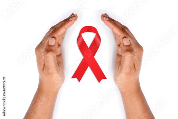 Obraz Aids awareness ribbon with hands on white background.