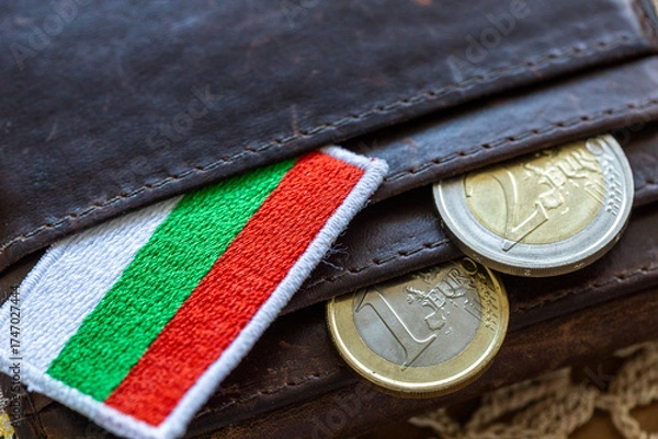 Fototapeta Euro coins falling out of a wallet with the Bulgarian flag. A financial and business concept. Bulgaria entry into the Eurozone.