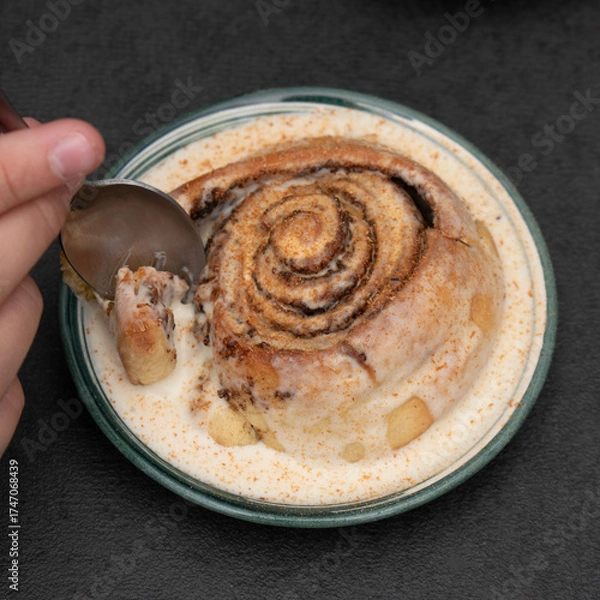 Obraz Chocolate dessert on plate served with hand holding fork.