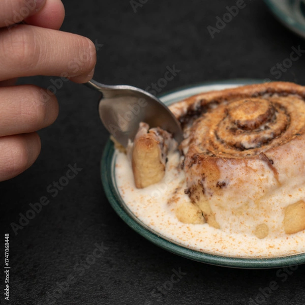 Obraz Chocolate dessert on plate served with hand holding fork.