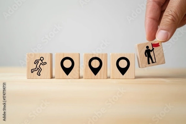Fototapeta Journey to the Destination: A hand places a cube with a figure holding a flag onto the other cubes, symbolizing the journey towards the destination, where goals are reached.