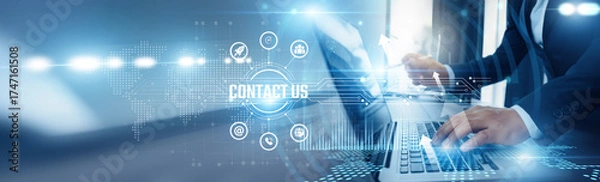 Fototapeta Businessman using laptop and contact us analyzing technological data, customer interaction channels, inquiry management, support ticketing, CRM integration, communication strategies