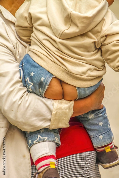 Fototapeta Instant access pants on child in farmers village in Xian, China.