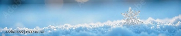 Fototapeta Delicate Snowflake on Soft Blue Winter Surface Tranquil Winter Scene of Peace and Serenity, Perfect for Holiday or Relaxation Themes