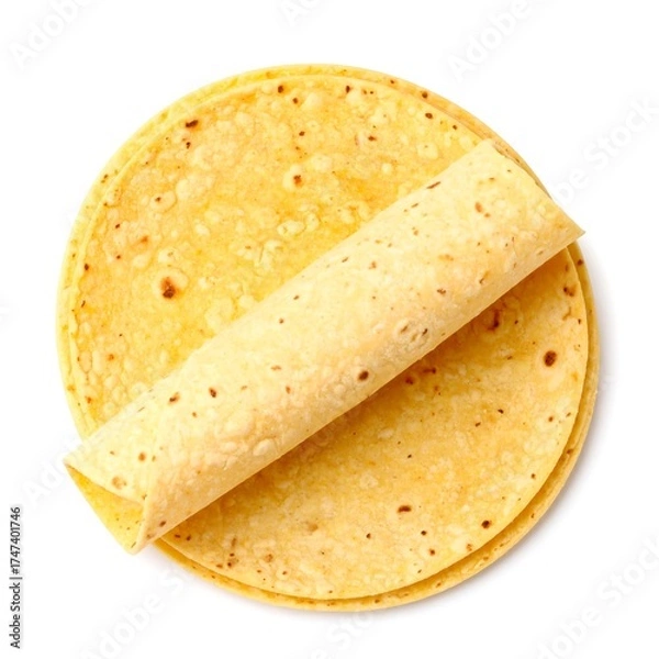 Fototapeta Two corn tortillas, one rolled atop the other, viewed from directly above