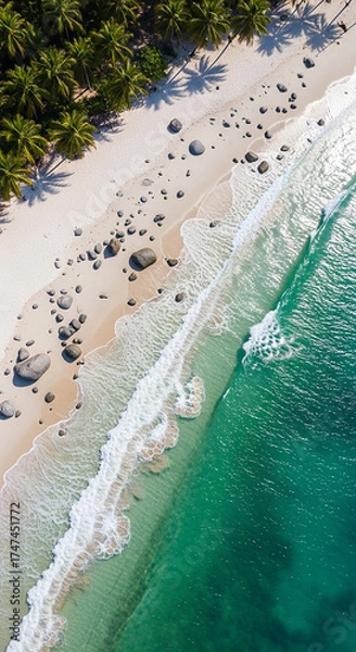 Fototapeta A realistic photography of beautiful diamond beach with gentle wave, clean water, white sand, coconut trees, and stone.
