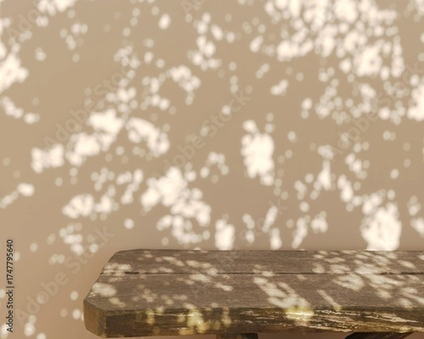 Fototapeta Rustic wooden table with abstract bokeh leaf shadow on wall in golden hour sunlight mockup background.