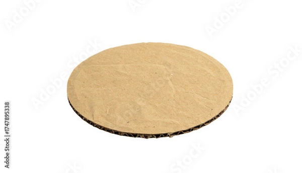 Fototapeta A circular piece of corrugated cardboard isolated on a black background