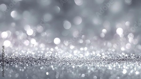 Fototapeta Soft lighting and bokeh enhance a shimmering silver background, perfect for events or artistic endeavors
