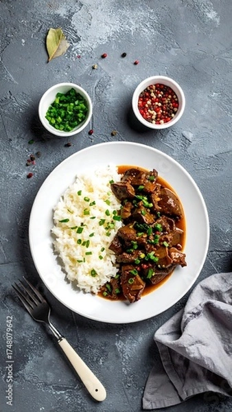 Obraz Braised meat with rice on a plate