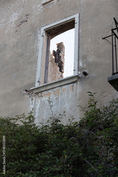 Fototapeta Overgrown Abandoned Villa with Broken Shutters and Balcony