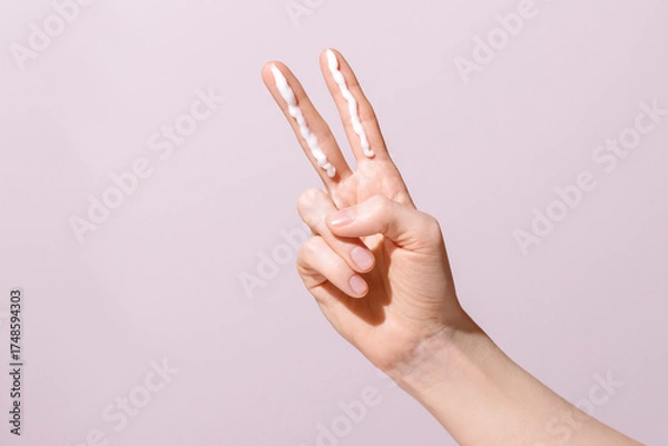 Obraz Two Finger Sunscreen Rule Concept on Pink Background
