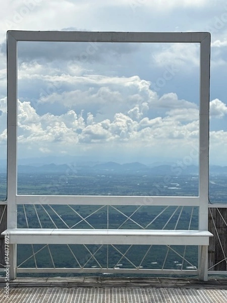 Fototapeta The window frame with cloudy sky in background