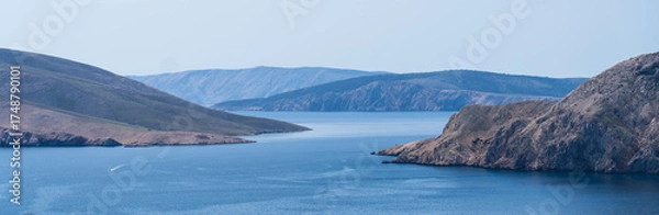 Fototapeta Prvić Island and Sveti Grgur, Croatia - April 20, 2025: Panoramic view of the mountains and sea.