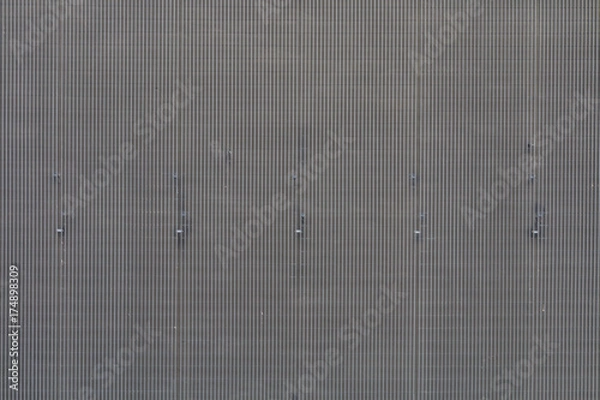 Fototapeta Grey texture with vertical lines.