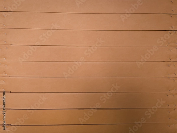 Obraz Macro view of layered corrugated cardboard showing cut edges and fluted texture. Ideal for abstract backgrounds, packaging design, or material studies.