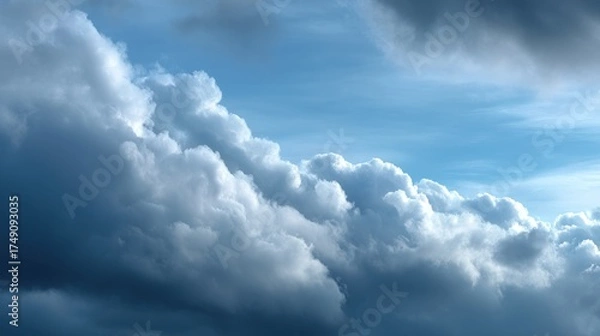 Fototapeta A serene view of fluffy clouds against a blue sky, creating a tranquil atmosphere that evokes calm and contemplation.