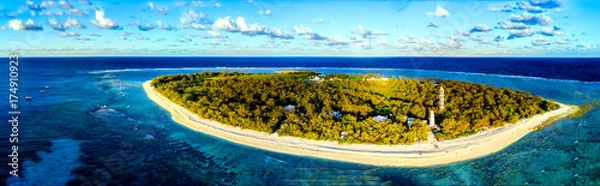 Fototapeta Aerial view of Lady Elliot Island coral reef in Queensland Australia. The lighthouse is visible on the bottom right. This is the first island of the great barrier reef. 