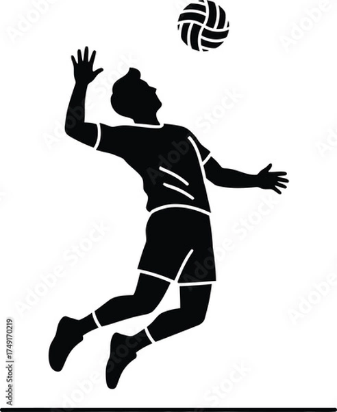 Fototapeta Silhouette of a male volleyball player spiking the ball during a game