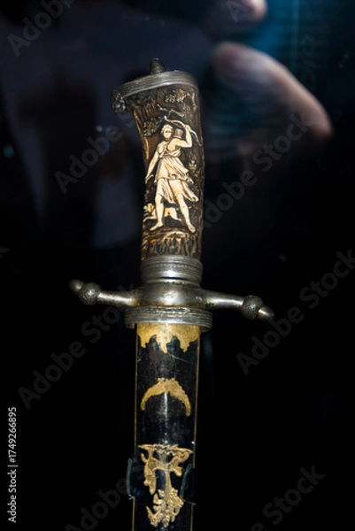 Obraz Medieval saber on a black background. Selective focus.