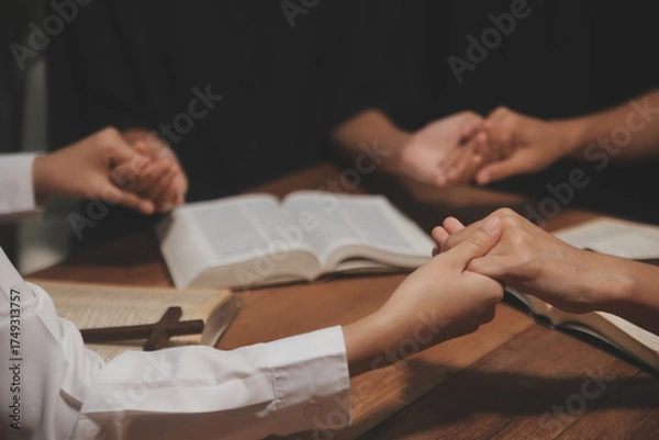 Fototapeta Christian group are praying to god with the bible and sharing the gospel. Concept of faith for god.