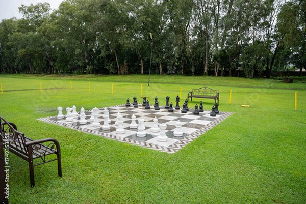 Fototapeta a giant outdoor chess board on a well maintained lawn