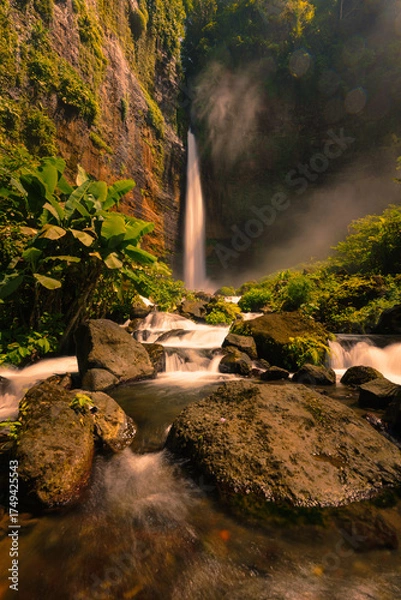 Fototapeta waterfall in the forest at Kapas Biru Waterfall Pronojiwo Lumajang East Java Indonesia