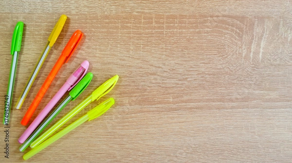 Fototapeta Colored pens lying on the table
