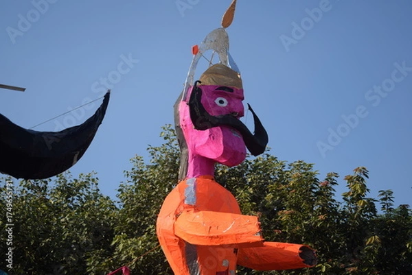Fototapeta Ravnans being ignited during Dussehra festival at ramleela ground in Delhi, India, Big statue of Ravana to get fire during the Fair of Dussera to celebrate the victory of truth by Lord Rama