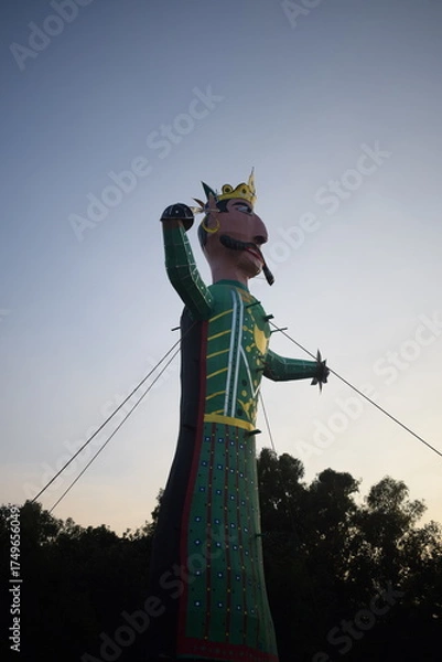 Fototapeta Ravnans being ignited during Dussehra festival at ramleela ground in Delhi, India, Big statue of Ravana to get fire during the Fair of Dussera to celebrate the victory of truth by Lord Rama