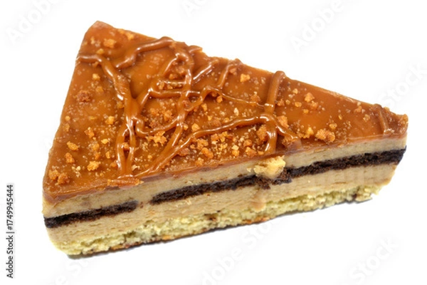 Fototapeta Biscuit creamy cake with layers of cake, whipped cream, biscuit paste and chocolate, a triangular piece of cake, celebration and holidays concept