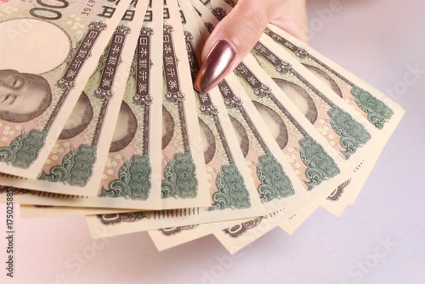 Obraz 1万円札と女性の手