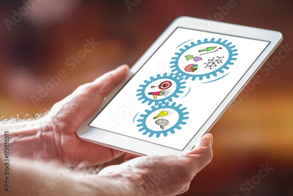 Fototapeta Business strategy concept on a tablet