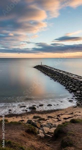 Obraz Coastal Serenity - A Stone Pier at Sunsets Embrace.