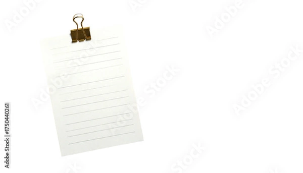 Fototapeta A lined paper held by a bulldog clip, against a black background