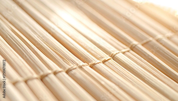 Fototapeta Close-up of woven bamboo, light-colored and tightly bound, angled composition