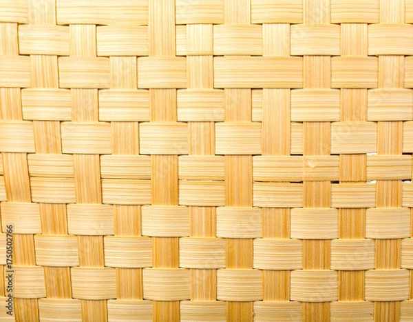 Fototapeta Close-up view of a woven basket texture showcasing a precise rectangular pattern