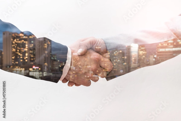 Obraz The double exposure image of the business man handshaking with another one during sunrise overlay with cityscape image. The concept of modern life, business, city life and teamwork.