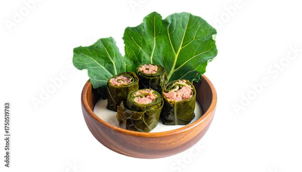Fototapeta Close-up view of stuffed rolls in a bowl, surrounded by greens, over creamy sauce