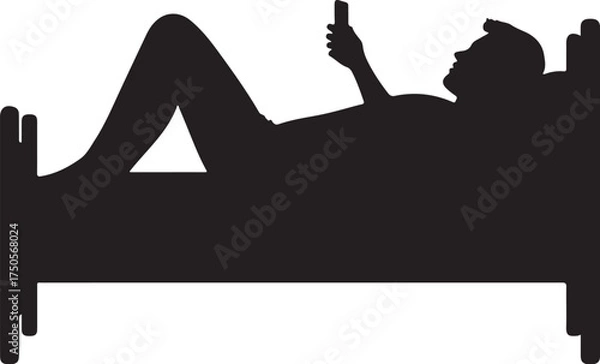 Obraz Silhouette of person lying in bed using smartphone