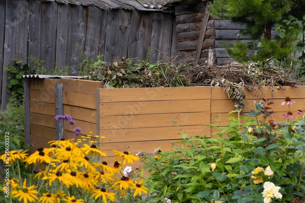 Fototapeta Compost bin in garden