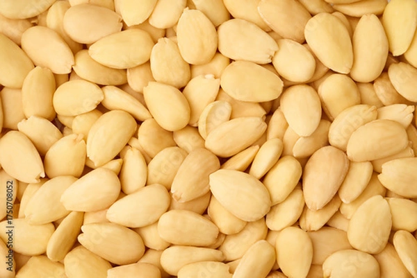 Fototapeta Peeled almonds close up macro background