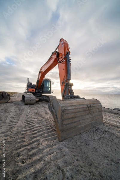 Fototapeta An excavating crane