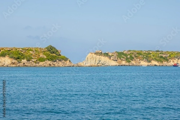 Fototapeta Seascape View of Vardiani or rabbit Island, Kefalonia, Showing the Split Headland and Blue Ionian Sea